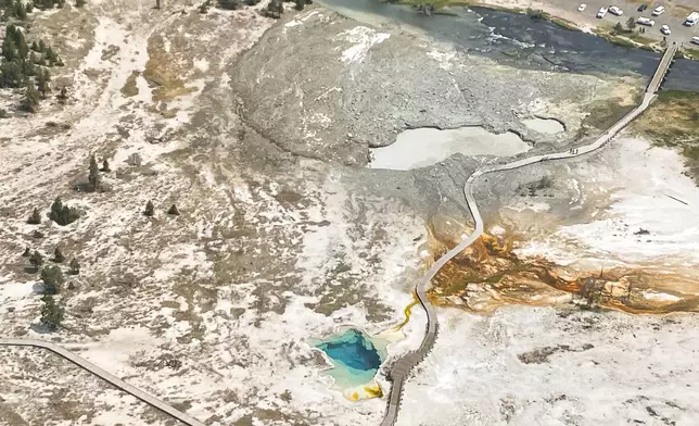 In this aerial photo released by the National Park Service, shows the damaged Biscuit Basin boardwalks after a hydrothermal explosion at Biscuit Basin in Yellowstone National Park, Wyo., Tuesday, July 23, 2024. (National Park Service via AP)