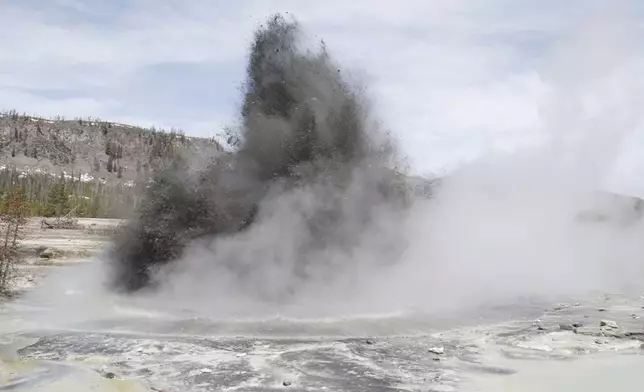 In this image released by the USGS agency, a hydrothermal event is seen in Biscuit Basin in Yellowstone National Park in 2009. Yellowstone officials say a similar explosion on Tuesday, July 23, 2024, sent tourists running for cover and destroyed a boardwalk. They say such events are relatively common. (USGS via AP)