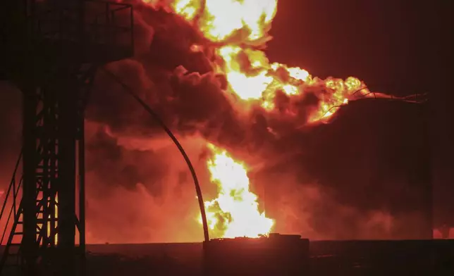 Oil tanks burn at the port in Hodeidah, Yemen, Saturday, July 20, 2024. The Israeli army said it has struck several Houthi targets in western Yemen following a fatal drone attack by the rebel group in Tel Aviv the previous day. (AP Photo)