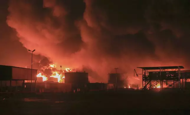 Oil tanks burn at the port in Hodeidah, Yemen, Saturday, July 20, 2024. The Israeli army said it has struck several Houthi targets in western Yemen following a fatal drone attack by the rebel group in Tel Aviv the previous day. (AP Photo)