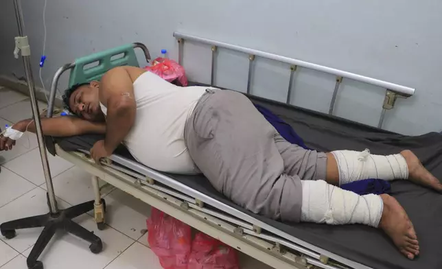 An injured Yemeni worker receives medical treatment at Al Thawrah hospital in Hodeidah, in western Yemen, following attacks, Saturday, July 20, 2024. The Israeli army said it has struck several Houthi targets in western Yemen following a fatal drone attack by the rebel group in Tel Aviv the previous day. (AP Photo)