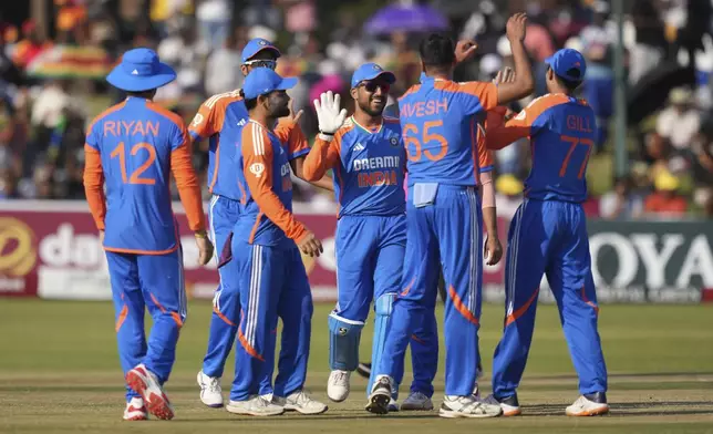 Indian players celebrate a wicket during the T20 cricket between Zimbabwe and India at Harare Sports club,Sunday, July 7,2024. (AP Photo/Tsvangirayi Mukwazhi)