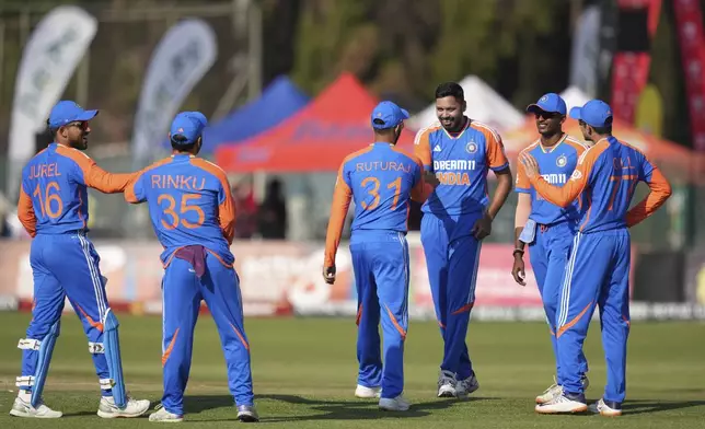 Indian players are seen on the pitch during the T20 cricket between Zimbabwe and India at Harare Sports club,Sunday, July 7,2024.(AP Photo/Tsvangirayi Mukwazhi)
