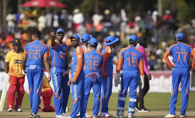 Indian players are seen on the pitch during the T20 cricket between Zimbabwe and India at Harare Sports club,Sunday, July 7,2024. (AP Photo/Tsvangirayi Mukwazhi)