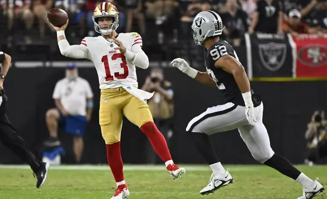 San Francisco 49ers quarterback Brock Purdy (13) throws against the Las Vegas Raiders during the first half of an NFL preseason football game, Friday, Aug. 23, 2024, in Las Vegas. (AP Photo/David Becker)