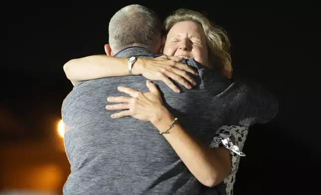 Elizabeth Whelan, right, hugs her brother Paul Whelan at Andrews Air Force Base, Md., following his release as part of a 24-person prisoner swap between Russia and the United States, Thursday, Aug. 1, 2024. (AP Photo/Alex Brandon)