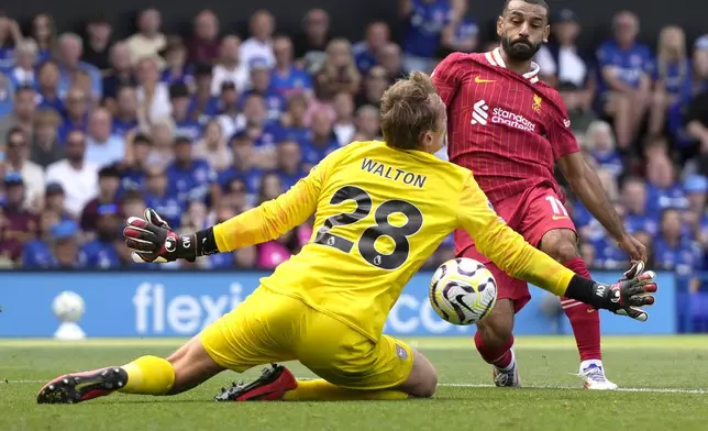 Liverpool's Mohamed Salah scores his side's second goal during the English Premier League soccer match between Ipswich Town and Liverpool at Portman Road stadium in Ipswich, England, Saturday, Aug. 17, 2024. (AP Photo/Alastair Grant)