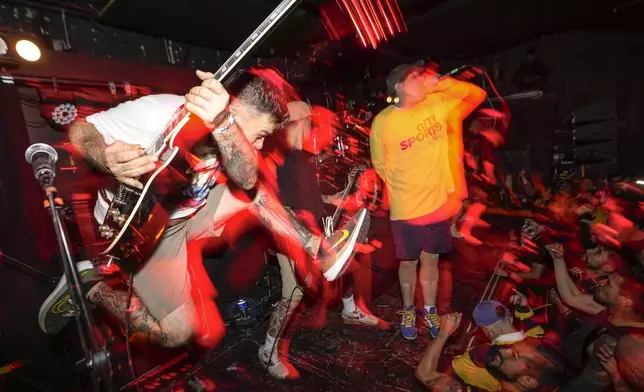 Guitarist Aaron Dalbec, of hardcore punk band Bane, performs in Bogota, Colombia, Friday, Aug. 16, 2024. (AP Photo/Matias Delacroix)