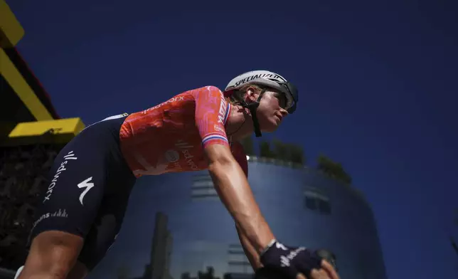 Demi Vollering of The Netherlands arrives for the start of the first stage of the Tour de France Women cycling race with start in Rotterdam and finish in The Hague, Netherlands, Monday, Aug. 12, 2024. (AP Photo/Peter Dejong)