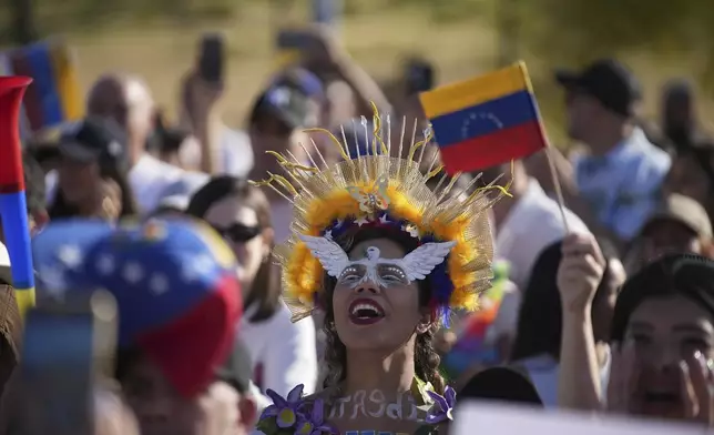 Venezuelan national Flormarys Gómez takes part in a protest against the results of her country's presidential election, declaring President Nicolas Maduro the winner, in Quito, Ecuador, Saturday, Aug. 3, 2024. (AP Photo/Carlos Noriega)