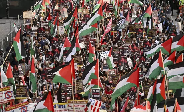 Protesters march during a demonstration outside the Democratic National Convention Wednesday, Aug. 21, 2024, in Chicago. (AP Photo/Noah Berger)