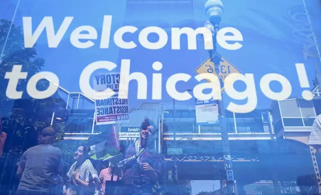 Protesters gather for a march to the Democratic National Convention Monday, Aug. 19, 2024, in Chicago. (AP Photo/Noah Berger)