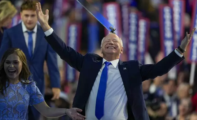 Democratic vice presidential nominee Minnesota Gov. Tim Walz reacts during the Democratic National Convention Wednesday, Aug. 21, 2024, in Chicago. (AP Photo/Matt Rourke)