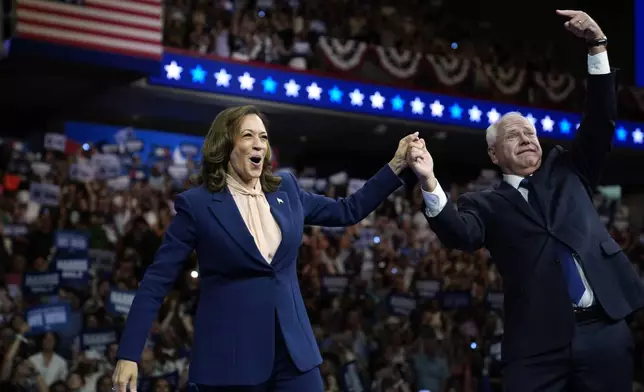 Democratic presidential nominee Vice President Kamala Harris and her running mate Minnesota Gov. Tim Walz speak at a campaign rally in Philadelphia, Tuesday, Aug. 6, 2024. (AP Photo/Matt Rourke)