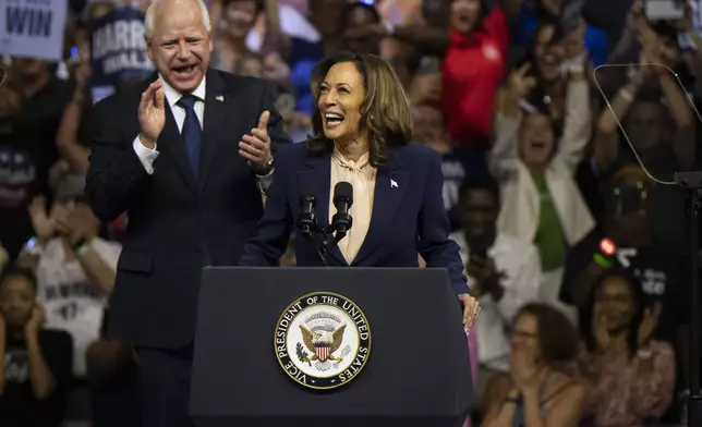 Democratic presidential nominee Vice President Kamala Harris and her running mate Minnesota Gov. Tim Walz speak at a campaign rally in Philadelphia, Tuesday, Aug. 6, 2024. (AP Photo/Joe Lamberti)