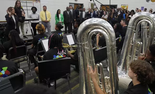 Democratic presidential nominee Vice President Kamala Harris speaks to marching band members at Liberty County High School in Hinesville, Ga., Wednesday, Aug. 28, 2024. (AP Photo/Jacquelyn Martin)