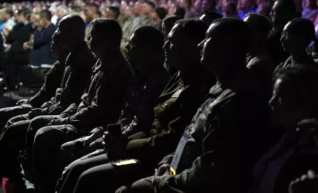 Attendees listen as Republican presidential nominee former President Donald Trump speaks at the National Guard Association of the United States' 146th General Conference, Monday, Aug. 26, 2024, in Detroit. (AP Photo/Carolyn Kaster)