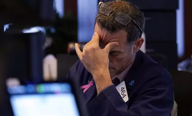 Trader Gregory Rowe works on the floor of the New York Stock Exchange, Monday, Aug. 5, 2024.(AP Photo/Richard Drew)