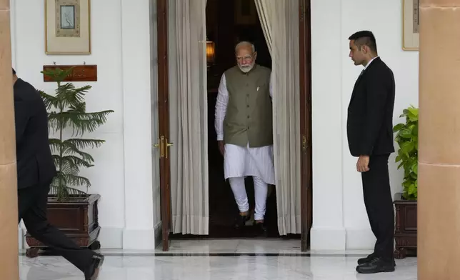 Indian Prime Minister Narendra Modi leaves to receive his Malaysian counterpart Anwar Ibrahim for a delegation level meeting in New Delhi, India, Tuesday, Aug. 20, 2024. (AP Photo/Manish Swarup)