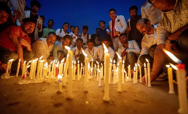 Allahabad Medical Association (AMA) and Resident doctors of SRN Hospital light candles as they protest against the rape and killing of a trainee doctor at a government hospital last week, in Prayagraj, Uttar Pradesh, India, Saturday, Aug. 17, 2024. (AP Photo/Rajesh Kumar Singh)