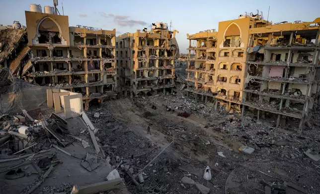 Palestinians inspect their houses after being destroyed byIsraeli bombardment on east of Deir al-Balah, Thursday, Aug. 29, 2024. (AP Photo/Abdel Kareem Hana)