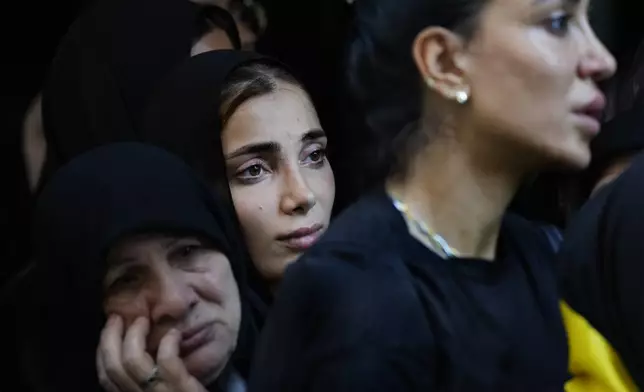 Mourners attend the funeral of Hezbollah commander Ali Jawad who was killed on Monday by an Israeli airstrike, in Beirut, Lebanon, Tuesday, Aug. 6, 2024. Since early October, Hezbollah began attacking Israeli military posts along the border calling it a backup front for their Palestinian allies in the Gaza Strip. (AP Photo/Hussein Malla)