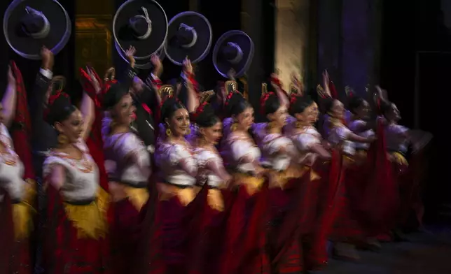 Dancers of the Ballet Folklórico of Mexico perform during a gala event at the Bellas Artes Fine Arts Center in Mexico City, Friday, Aug. 16, 2024. (AP Photo/Fernando Llano)