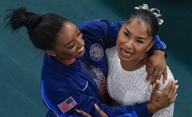 Jordan Chiles, of the United States, and Simone Biles, of the United States, celebrate after the women's artistic gymnastics individual floor finals in Bercy Arena at the 2024 Summer Olympics, Monday, Aug. 5, 2024, in Paris, France. Biles won the silver medal and Chiles the bronze medal. (AP Photo/Morry Gash)