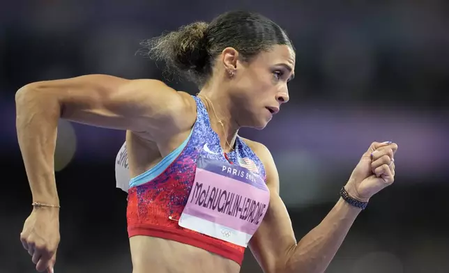 Sydney McLaughlin-Levrone, of the United States competes in the women's 400 meters hurdles final at the 2024 Summer Olympics, Thursday, Aug. 8, 2024, in Saint-Denis, France. (AP Photo/Ashley Landis)