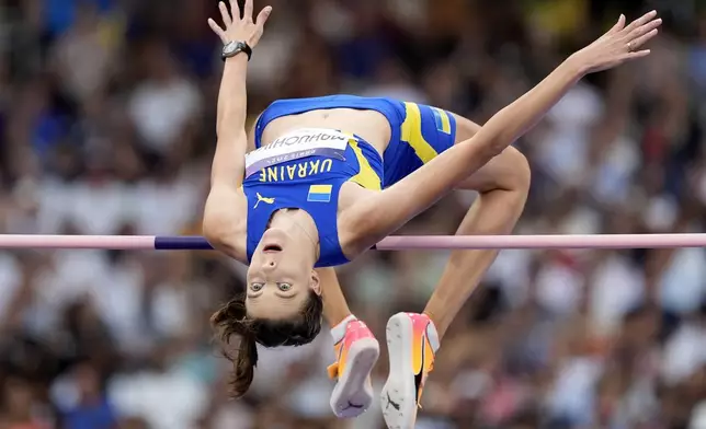 Yaroslava Mahuchikh, of Ukraine, competes in the women's high jump final at the 2024 Summer Olympics, Sunday, Aug. 4, 2024, in Saint-Denis, France. (AP Photo/Matthias Schrader)