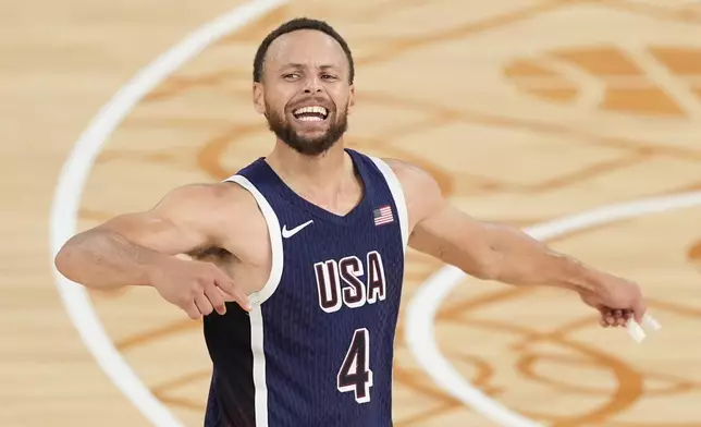 United States' Stephen Curry (4) reacts after winning a men's gold medal basketball game against France at Bercy Arena at the 2024 Summer Olympics, Saturday, Aug. 10, 2024, in Paris, France. (AP Photo/Michael Conroy)