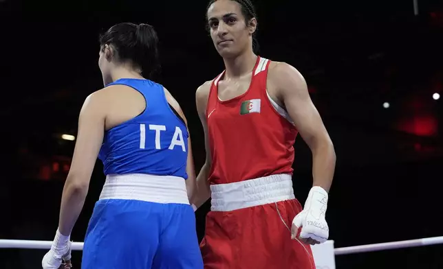 Algeria's Imane Khelif, right, after defeating Italy's Angela Carini, left, in their women's 66kg preliminary boxing match at the 2024 Summer Olympics, Thursday, Aug. 1, 2024, in Paris, France. (AP Photo/John Locher)