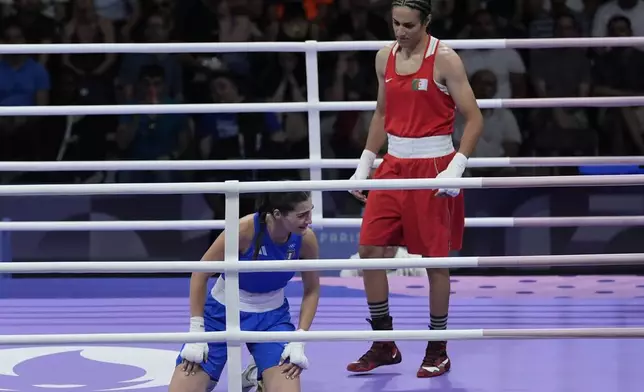 Algeria's Imane Khelif, right, defeated, Italy's Angela Carini in their women's 66kg preliminary boxing match at the 2024 Summer Olympics, Thursday, Aug. 1, 2024, in Paris, France. (AP Photo/John Locher)