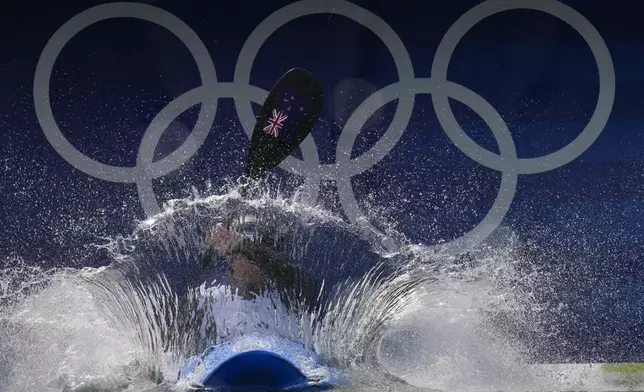 Finn Butcher of New Zealand competes in the men's kayak cross time trial at the 2024 Summer Olympics, Friday, Aug. 2, 2024, in Vaires-sur-Marne, France. (AP Photo/Kirsty Wigglesworth)