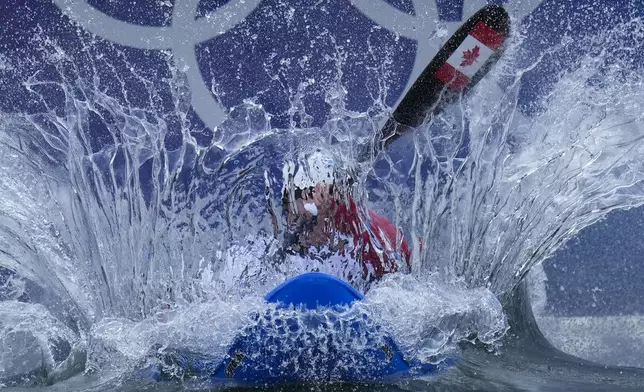 Lois Betteridge of Canada competes in the women's kayak cross time trial at the 2024 Summer Olympics, Friday, Aug. 2, 2024, in Vaires-sur-Marne, France. (AP Photo/Kirsty Wigglesworth)