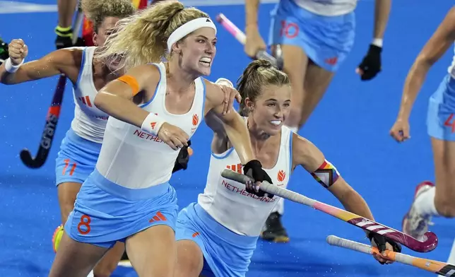 Netherlands' Yibbi Jansen, front left, celebrates after scoring her side's first goal during the women's gold medal field hockey match between China and Netherlands at the Yves-du-Manoir Stadium during the 2024 Summer Olympics, Friday, Aug. 9, 2024, in Colombes, France. (AP Photo/Aijaz Rahi)