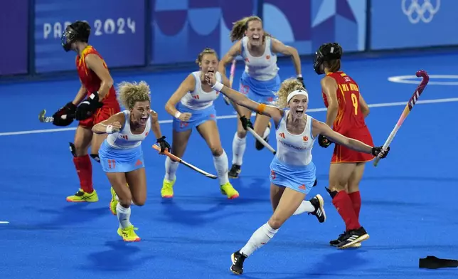 Netherlands' Yibbi Jansen, second right, celebrates after scoring her side's first goal during the women's gold medal field hockey match between China and Netherlands at the Yves-du-Manoir Stadium during the 2024 Summer Olympics, Friday, Aug. 9, 2024, in Colombes, France. (AP Photo/Aijaz Rahi)