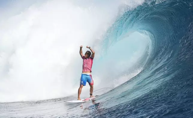 Kauli Vaast, of France, celebrates during the gold medal match of the surfing competition at the 2024 Summer Olympics, Monday, Aug. 5, 2024, in Teahupo'o, Tahiti. (AP Photo/Gregory Bull)