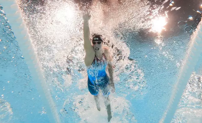 Katie Ledecky, of the United States, competes in the women's 1500-meter freestyle final at the 2024 Summer Olympics, Wednesday, July 31, 2024, in Nanterre, France. Ledecky won gold setting a new Olympic record. (AP Photo/David J. Phillip)