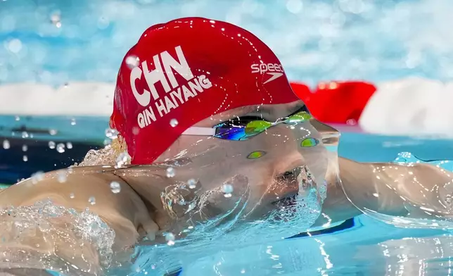 Haiyang Qin, of China, competes during a heat in the men's 100-meter breaststroke at the 2024 Summer Olympics, Saturday, July 27, 2024, in Nanterre, France. (AP Photo/Petr David Josek)