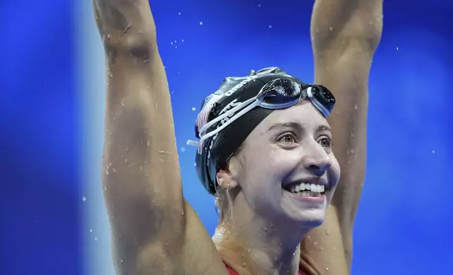 Kate Douglass, of the United States, celebrates after winning the women's 200-meter breaststroke final at the 2024 Summer Olympics in Nanterre, France, Thursday, Aug. 1, 2024. (AP Photo/Martin Meissner)