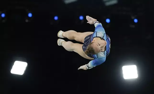 Anzhela Bladtceva of the Individual Neutral Athletes competes during the women's trampoline qualification round in Bercy Arena at the 2024 Summer Olympics, Friday, Aug. 2, 2024, in Paris, France. (AP Photo/Charlie Riedel)