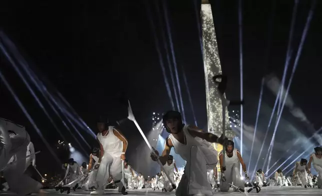 Artists perform during the Opening Ceremony for the 2024 Paralympics, Wednesday, Aug. 28, 2024, at La Concorde square in Paris, France. (AP Photo/Thibault Camus, Pool)