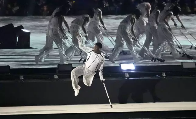 South African dancer Musa Motha performs during the Opening Ceremony for the 2024 Paralympics, Wednesday, Aug. 28, 2024, in Paris, France. (AP Photo/Michel Euler)