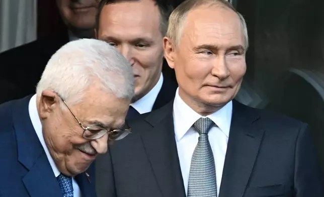 Palestinian President Mahmoud Abbas, left, and Russian President Vladimir Putin walk after their meeting at Novo-Ogaryovo state residence outside Moscow, Russia, Tuesday, Aug. 13, 2024. (Alexey Maishev, Sputnik, Kremlin Pool Photo via AP)