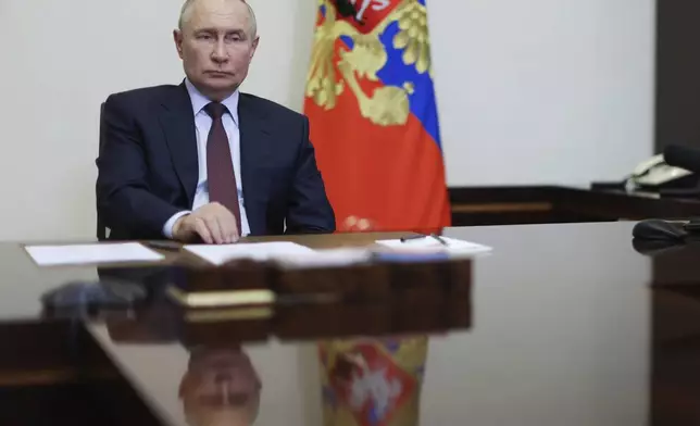 Russian President Vladimir Putin holds a meeting on economic issues via video conference at Novo-Ogaryovo state residence outside of Moscow, Russia, Monday, Aug. 26, 2024. (Alexander Kazakov, Sputnik, Kremlin Pool Photo via AP)