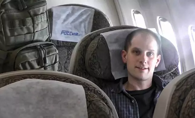 In this image made from video provided by Russian Federal Security Service via RTR on Thursday, Aug. 1, 2024, Wall Street Journal reporter Evan Gershkovich sits inside an airplane at an airport outside Moscow, Russia. (Russian Federal Security Service/RTR via AP)