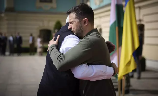 In this photo provided by the Ukrainian Presidential Press Office, shows Indian Prime Minister Narendra Modi, left, greeting Ukrainian President Volodymyr Zelenskyy in Kyiv, Ukraine, Friday, Aug. 23, 2024. (Ukrainian Presidential Press Office via AP)