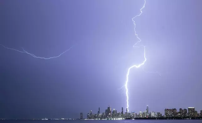 Lightning strikes after a sever storm passes through over Chicago, Tuesday, Aug. 27, 2024. (Tyler Pasciak LaRiviere/Chicago Sun-Times via AP)