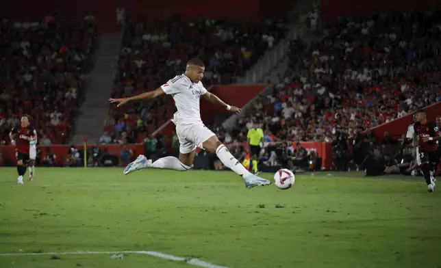 Real Madrid's Kylian Mbappe controls the ball during a Spanish La Liga soccer match between Mallorca and Real Madrid at the Son Moix Stadium in Palma de Mallorca, Spain, Sunday, Aug. 18, 2024. (AP Photo/Francisco Ubilla)